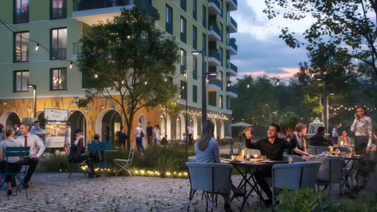 Abendliche Szene im Café des Wohnquartiers ORPLID mit Gästen im Freien